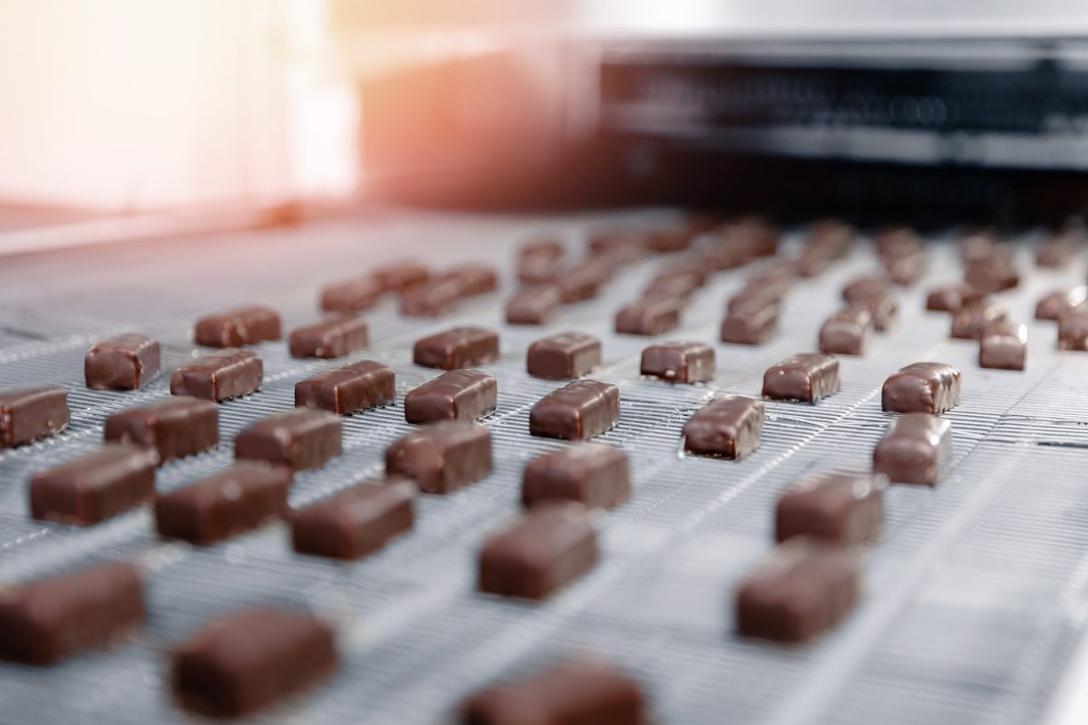 Image of chocolates on a manufacturing line for Receptful and Hershey Featured Business Story